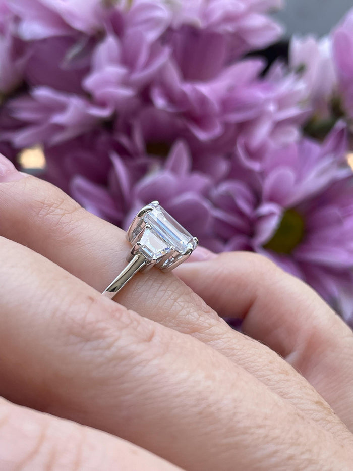 Three stone engagement ring with 3CT emerald cut CZ simulated diamond