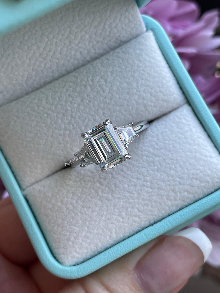 Three stone engagement ring with 3CT emerald cut CZ simulated diamond