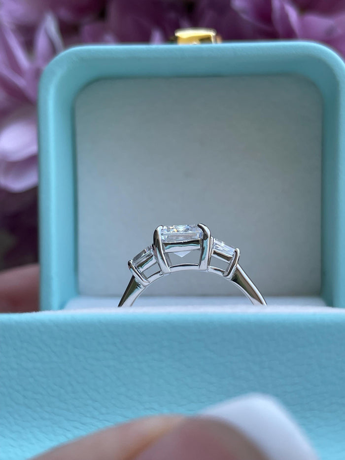 Three stone engagement ring with 3CT emerald cut CZ simulated diamond