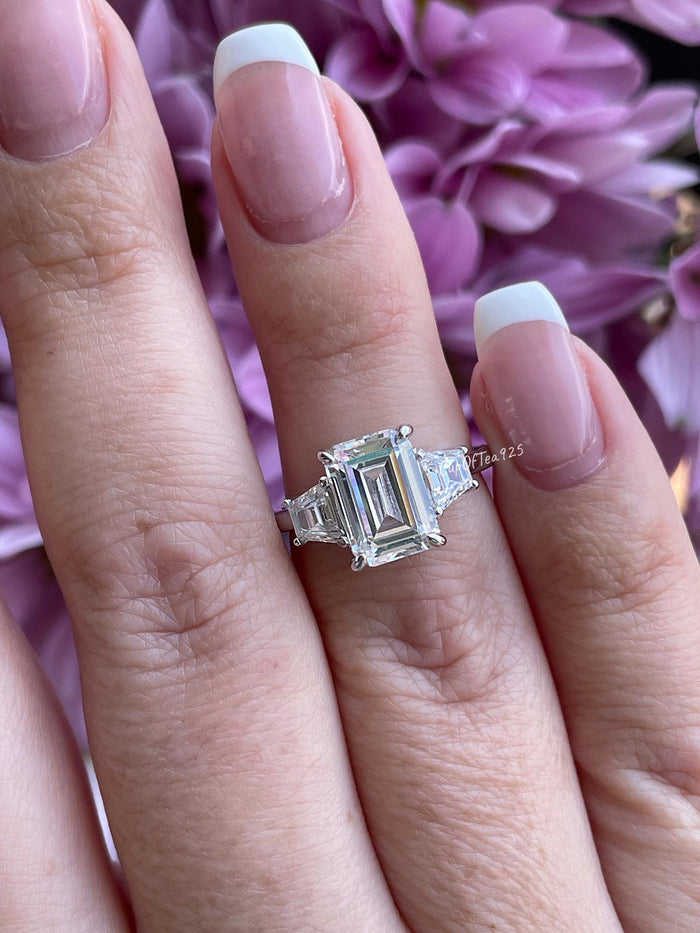Three stone engagement ring with 3CT emerald cut CZ simulated diamond