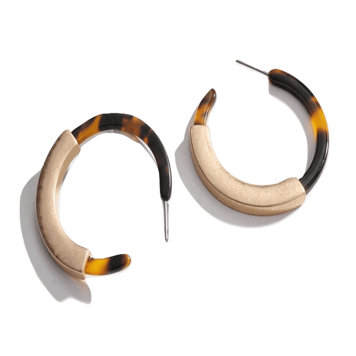 Tortoise hoop earrings with gold-toned inner curve and visible pin back