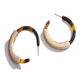 Tortoise hoop earrings with gold-toned inner curve and visible pin back