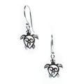 A pair of sterling silver earrings in the shape of a turtle.