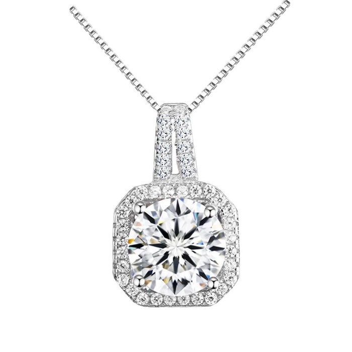 Cubic zirconia halo pendant necklace with cushion-shaped center stone, silver-tone chain.