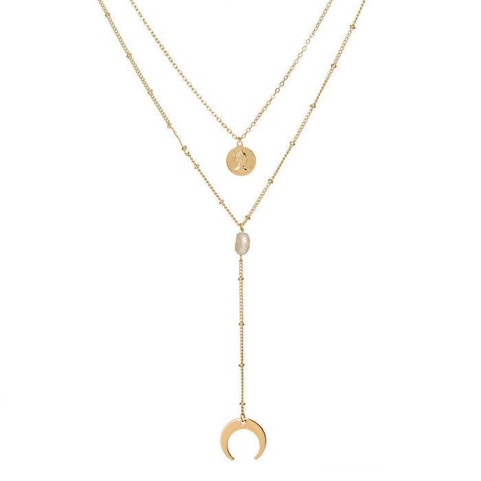 Two-layer gold necklace with moon charms, coin medallion, and pearl drop