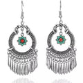 Silver-tone flower dangle earrings with hoop filigree and turquoise/red center tassels