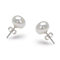 Pair of white freshwater pearl stud earrings, 6–7mm, with silver posts and backs.