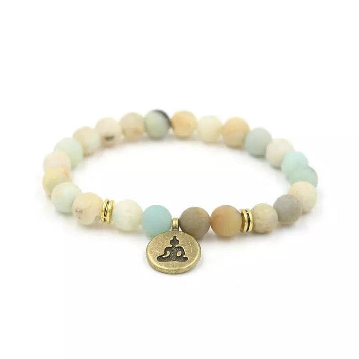 Yoga bracelet with light beads and round Buddha charm, gold accent rings