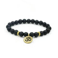 Black bead yoga bracelet with gold Om charm and two gold accent rings