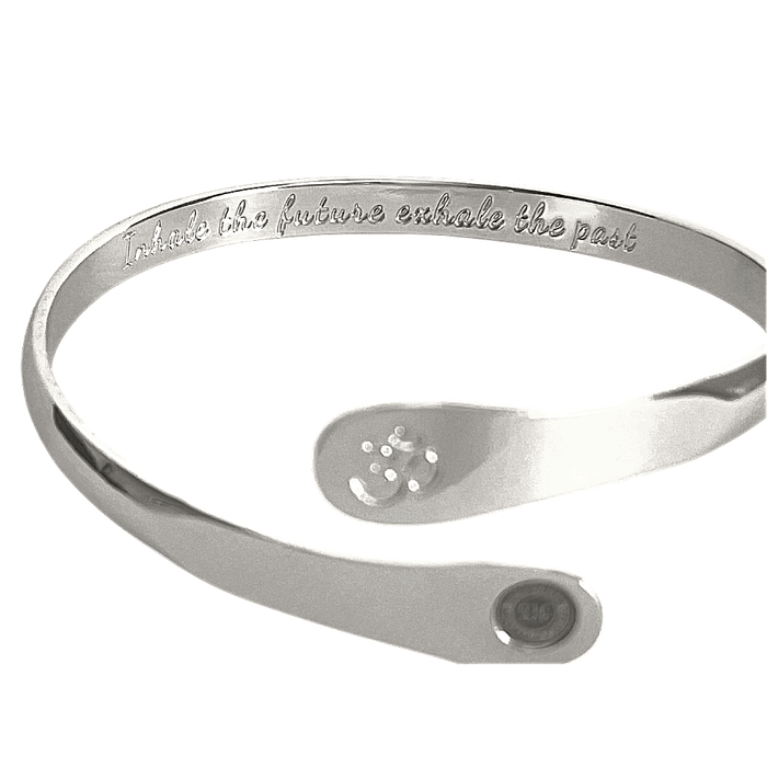 Silver yoga bracelet with engraved inner text, Om symbol plate, and round logo on side